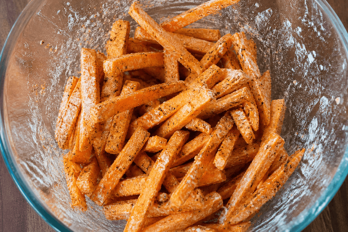 Sweet potato fries tossed with cornstarch and spices