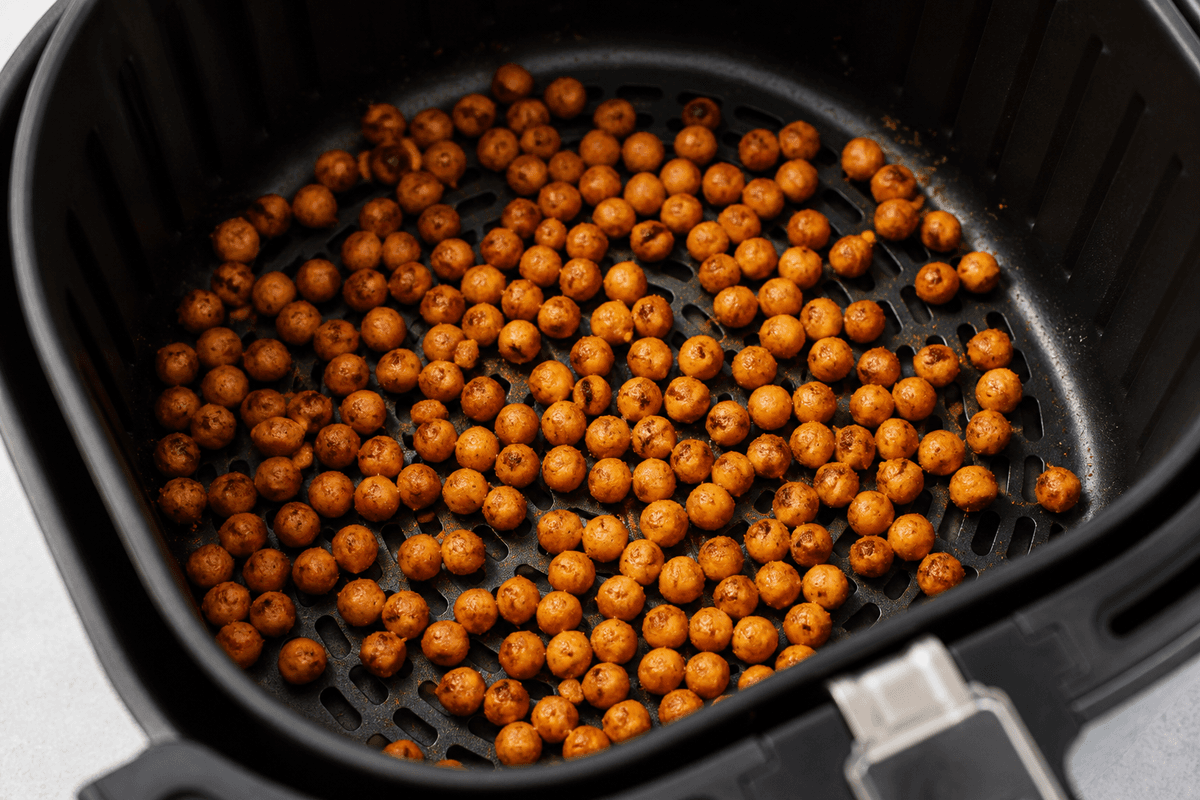 Chickpeas crisping in the air fryer basket