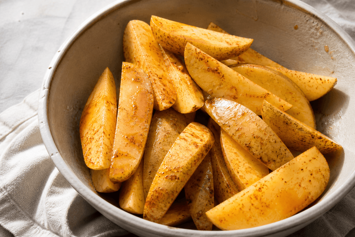 Potato wedges tossed with oil and paprika