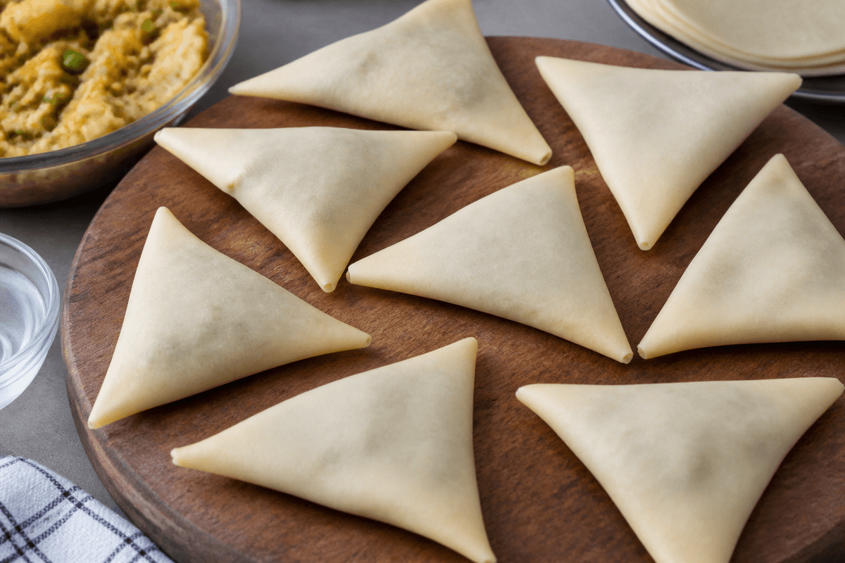 Vegetable samosas folded and sealed